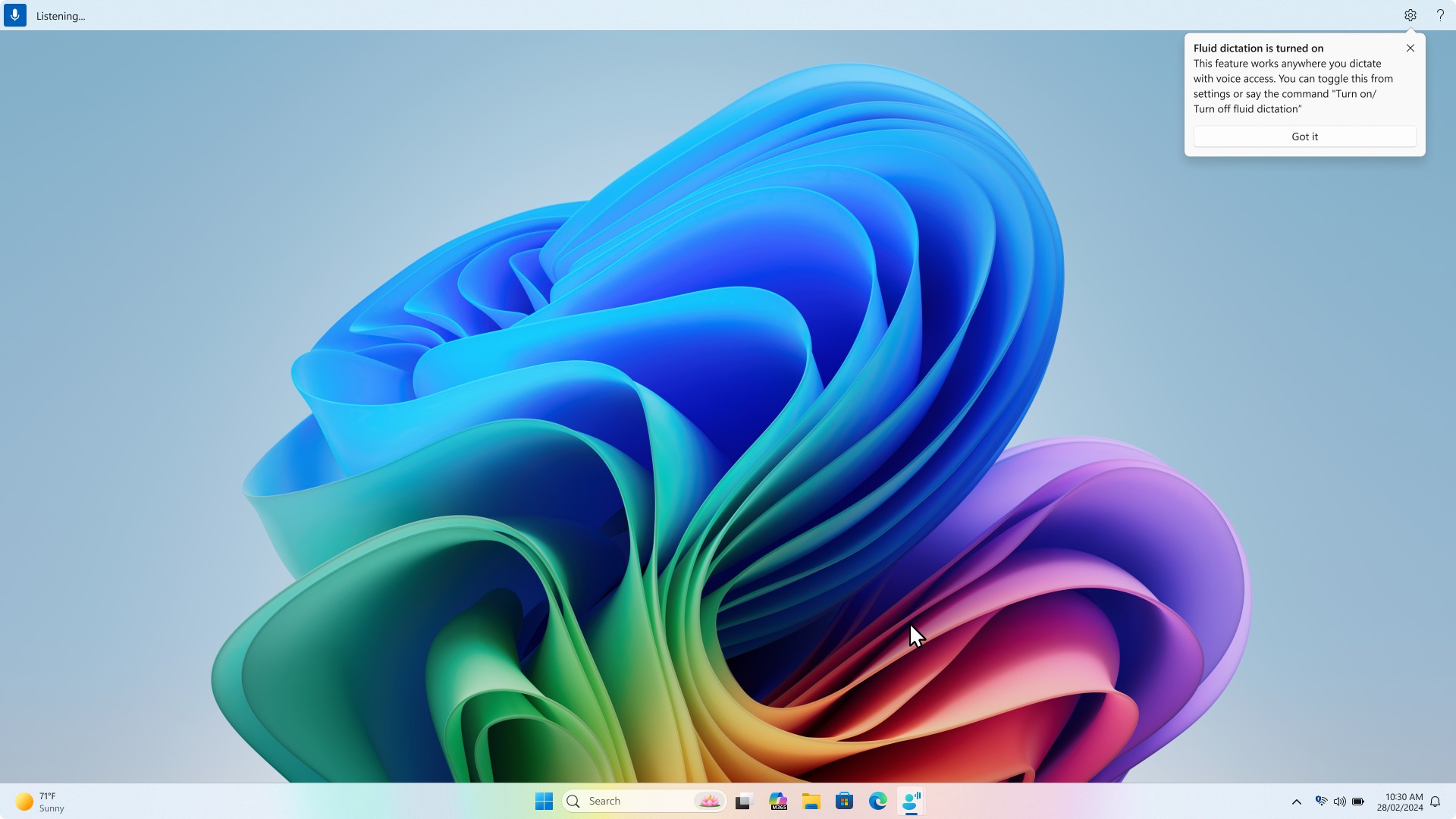Screen showing a notification dialog titled Fluid dictation is turned on. The message explains that the feature works anywhere you dictate with voice access and can be toggled from settings or by saying Turn on or Turn off fluid dictation.